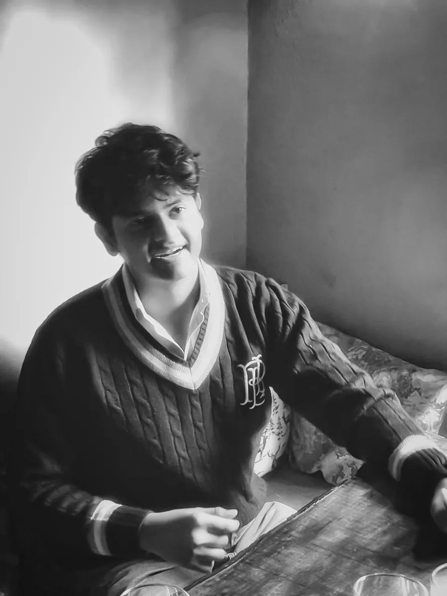 Ar. Anshuman Singh Bhadouria, founder of Noxcraft Studio, seated at a wooden table in natural light